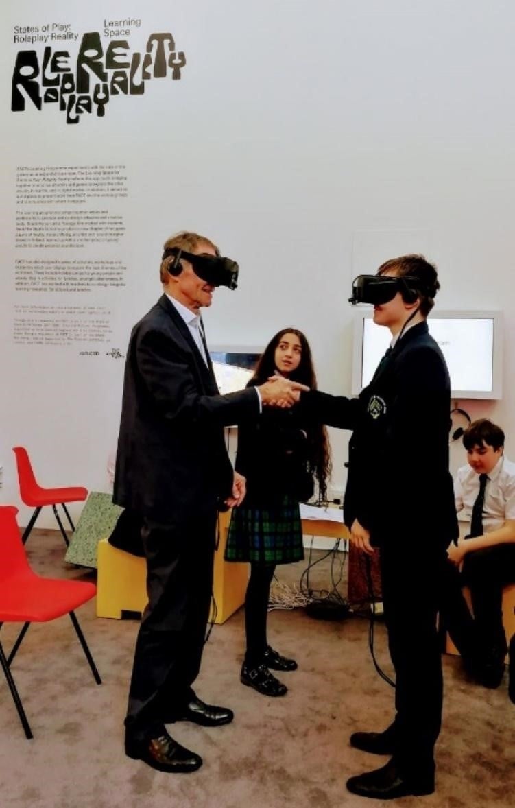 Sir Nicholas Serota Experiences Virtual Reality With Arts Award Group   Sir Nick Serota VR With Student 